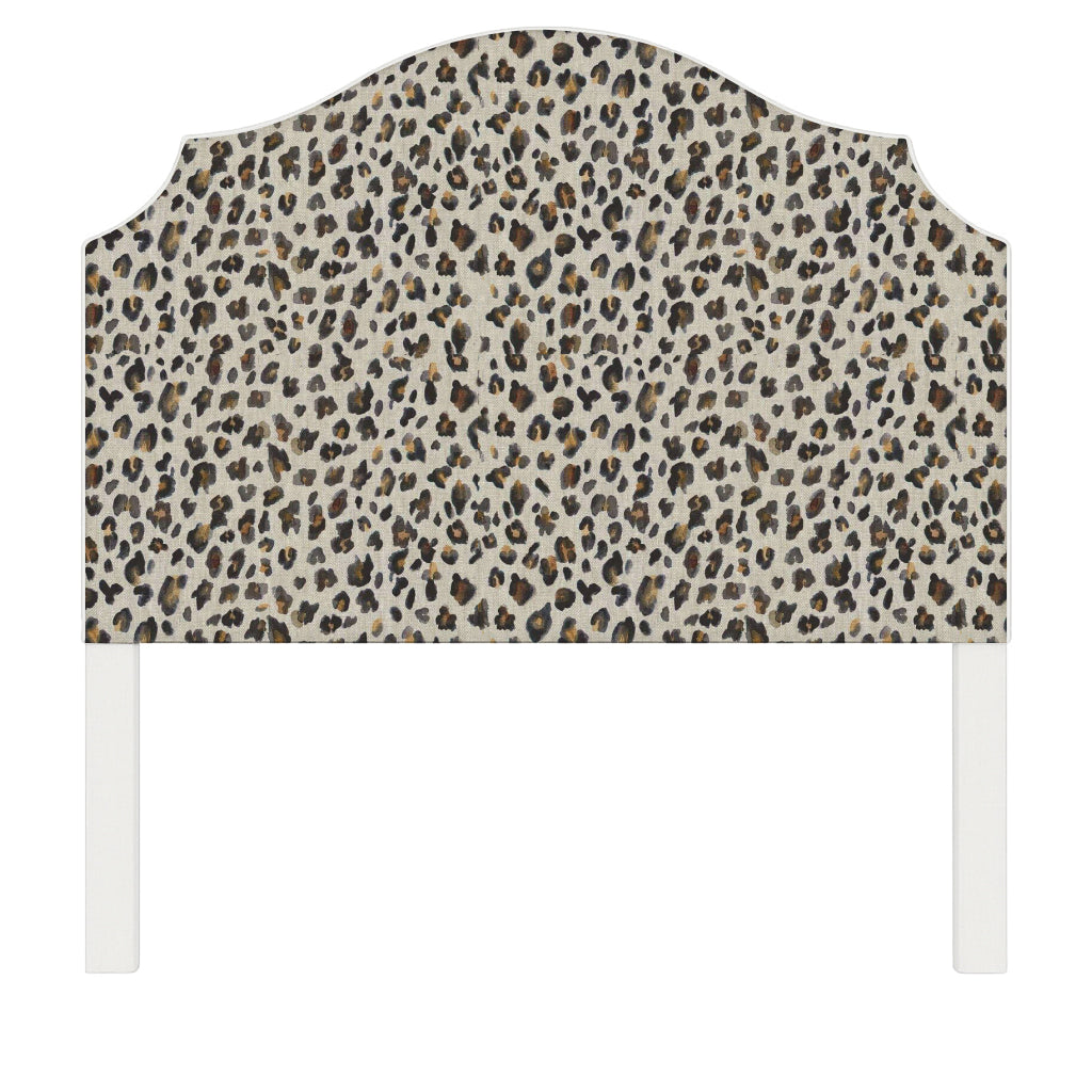 Bella upholstered headboard in Fabric&Frame Spinach on Pink, shown on a white bed base in a modern bedroom.