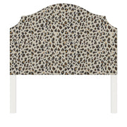 Bella upholstered headboard in Fabric&Frame Spinach on Pink, shown on a white bed base in a modern bedroom.