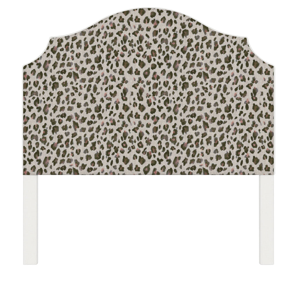 Bella upholstered headboard in Fabric&Frame Spinach on Pink, shown on a white bed base in a modern bedroom.