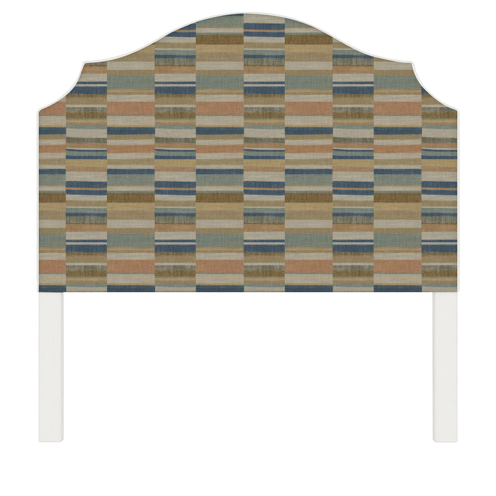 Bella upholstered headboard in Fabric&Frame Rhubarb, shown on a white bed base in a modern bedroom.