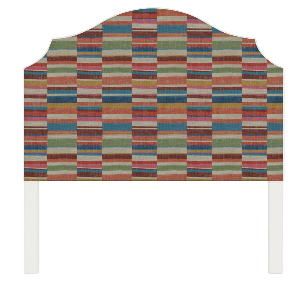 Bella upholstered headboard in Fabric&Frame Rhubarb, shown on a white bed base in a modern bedroom.