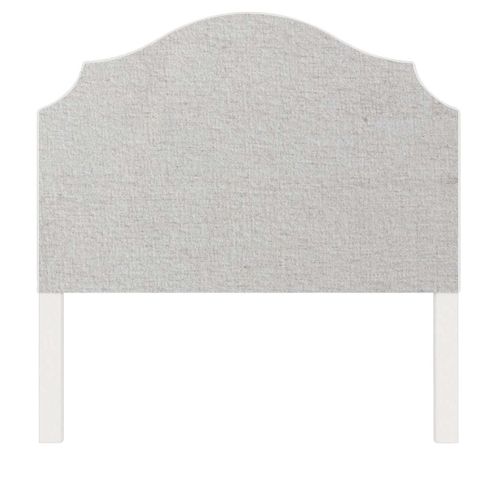 Bella upholstered headboard in Fabric&Frame Santorini, shown on a white bed base in a modern bedroom.