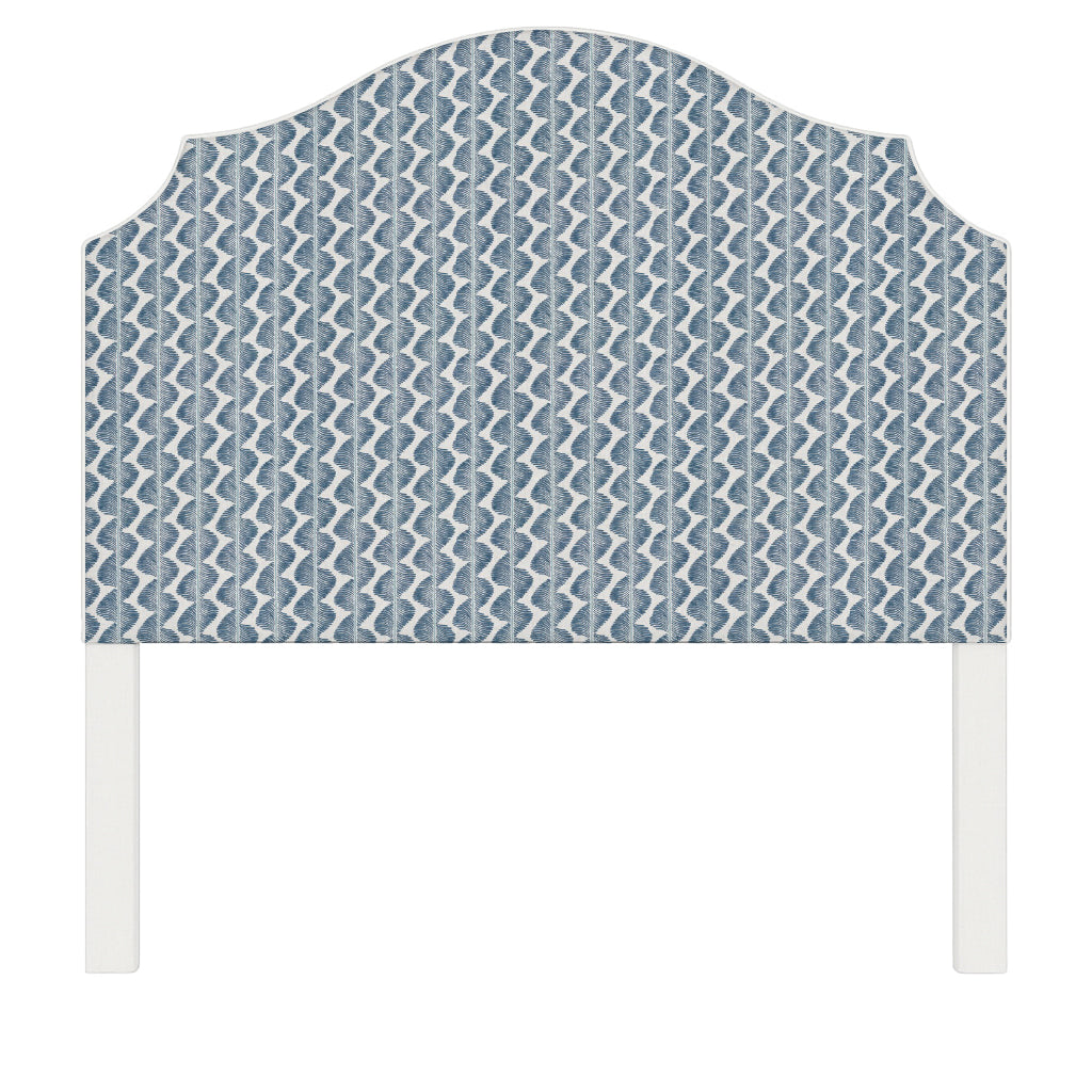 Bella upholstered headboard in Fabric&Frame Buxton Blue, shown on a white bed base in a modern bedroom.