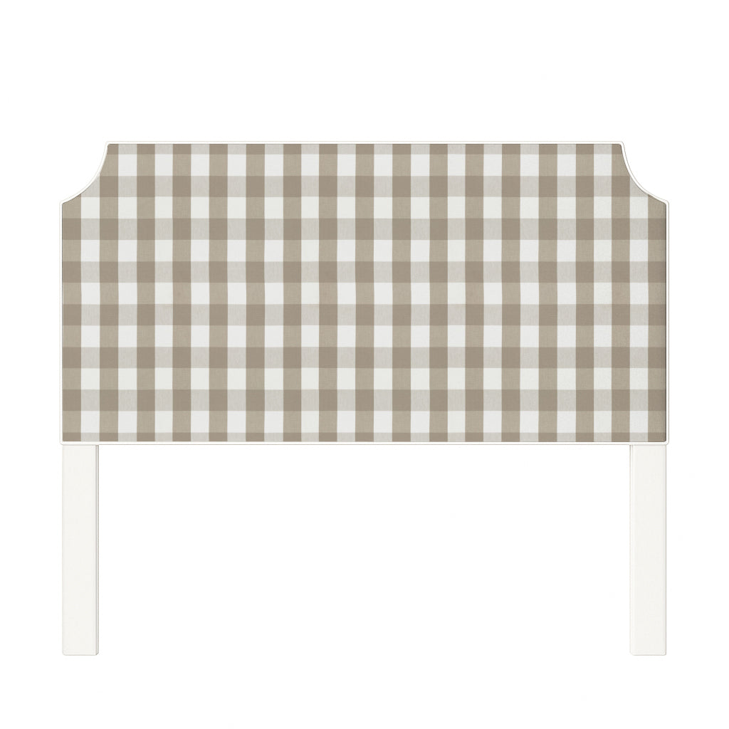 Charlotte upholstered headboard in Fabric&Frame Indigo, shown on a white bed base in a modern bedroom.