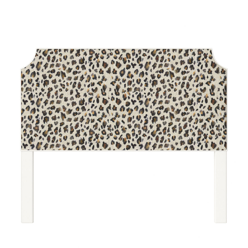 Charlotte upholstered headboard in Fabric&Frame Spinach on Pink, shown on a white bed base in a modern bedroom.