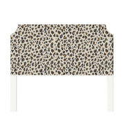 Charlotte upholstered headboard in Fabric&Frame Spinach on Pink, shown on a white bed base in a modern bedroom.