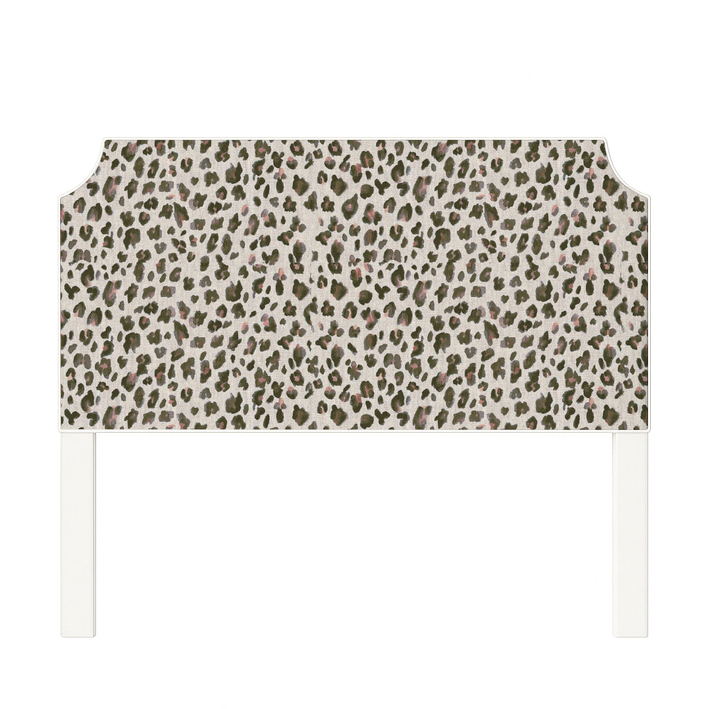 Charlotte upholstered headboard in Fabric&Frame Spinach on Pink, shown on a white bed base in a modern bedroom.