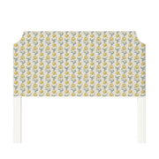 Charlotte upholstered headboard in Fabric&Frame Ochre, shown on a white bed base in a modern bedroom.