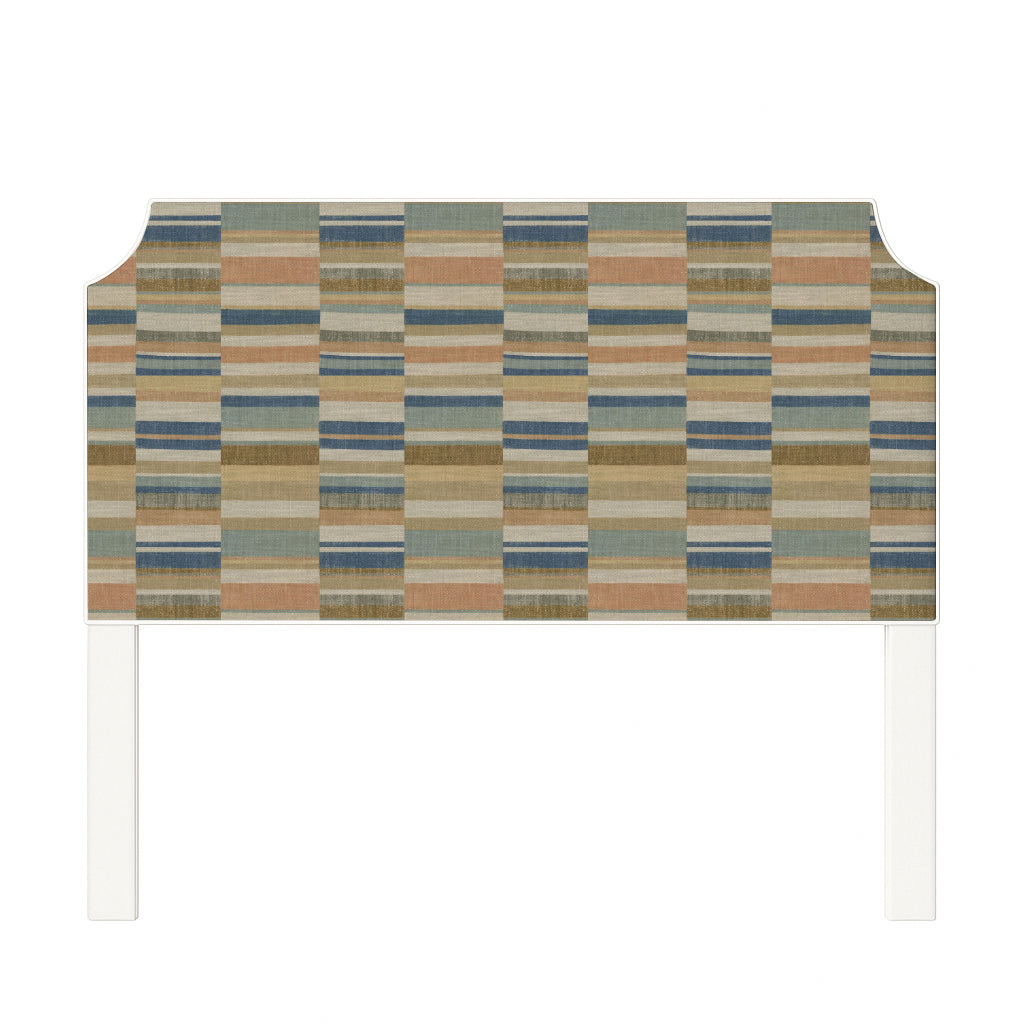 Charlotte upholstered headboard in Fabric&Frame Rhubarb, shown on a white bed base in a modern bedroom.