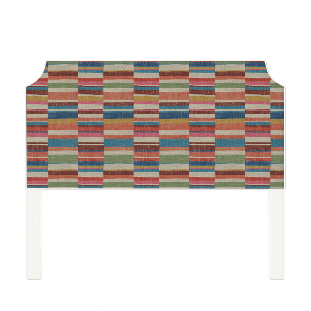 Charlotte upholstered headboard in Fabric&Frame Rhubarb, shown on a white bed base in a modern bedroom.