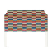 Charlotte upholstered headboard in Fabric&Frame Rhubarb, shown on a white bed base in a modern bedroom.