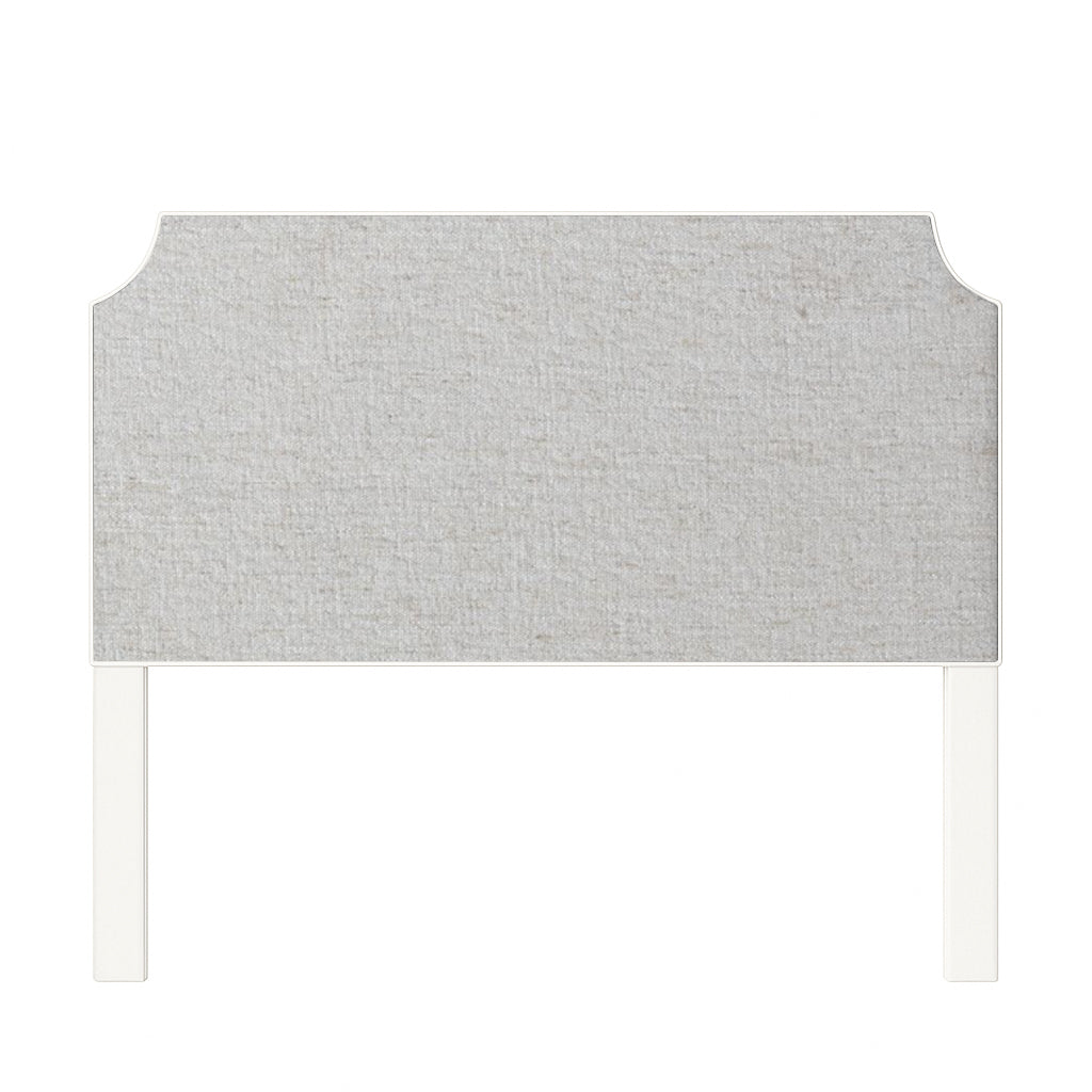 Charlotte upholstered headboard in Fabric&Frame Santorini, shown on a white bed base in a modern bedroom.