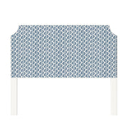 Charlotte upholstered headboard in Fabric&Frame Buxton Blue, shown on a white bed base in a modern bedroom.