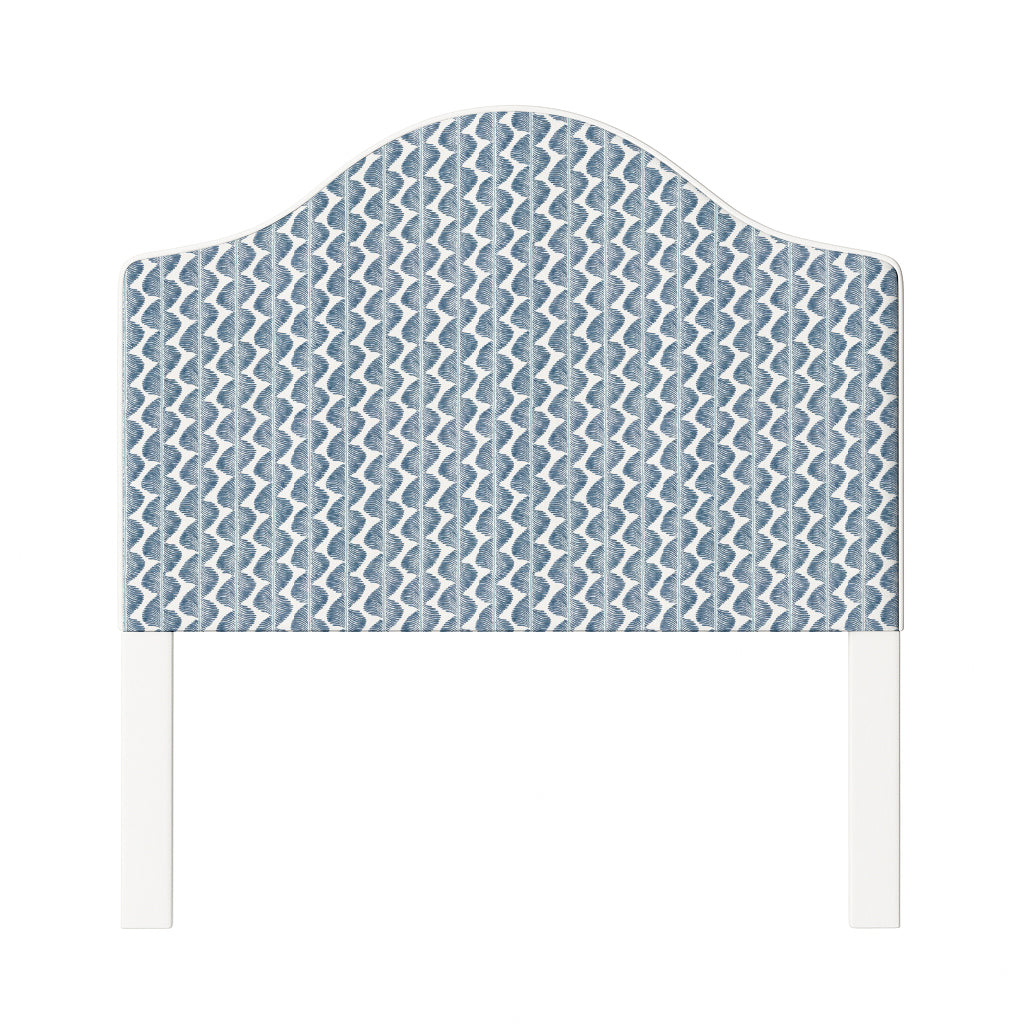 Daisy upholstered headboard in Fabric&Frame Buxton Blue, shown on a white bed base in a modern bedroom.