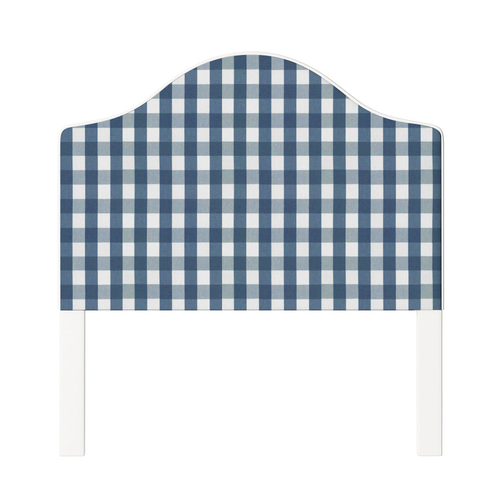 Daisy upholstered headboard in Fabric&Frame Indigo, shown on a white bed base in a modern bedroom.
