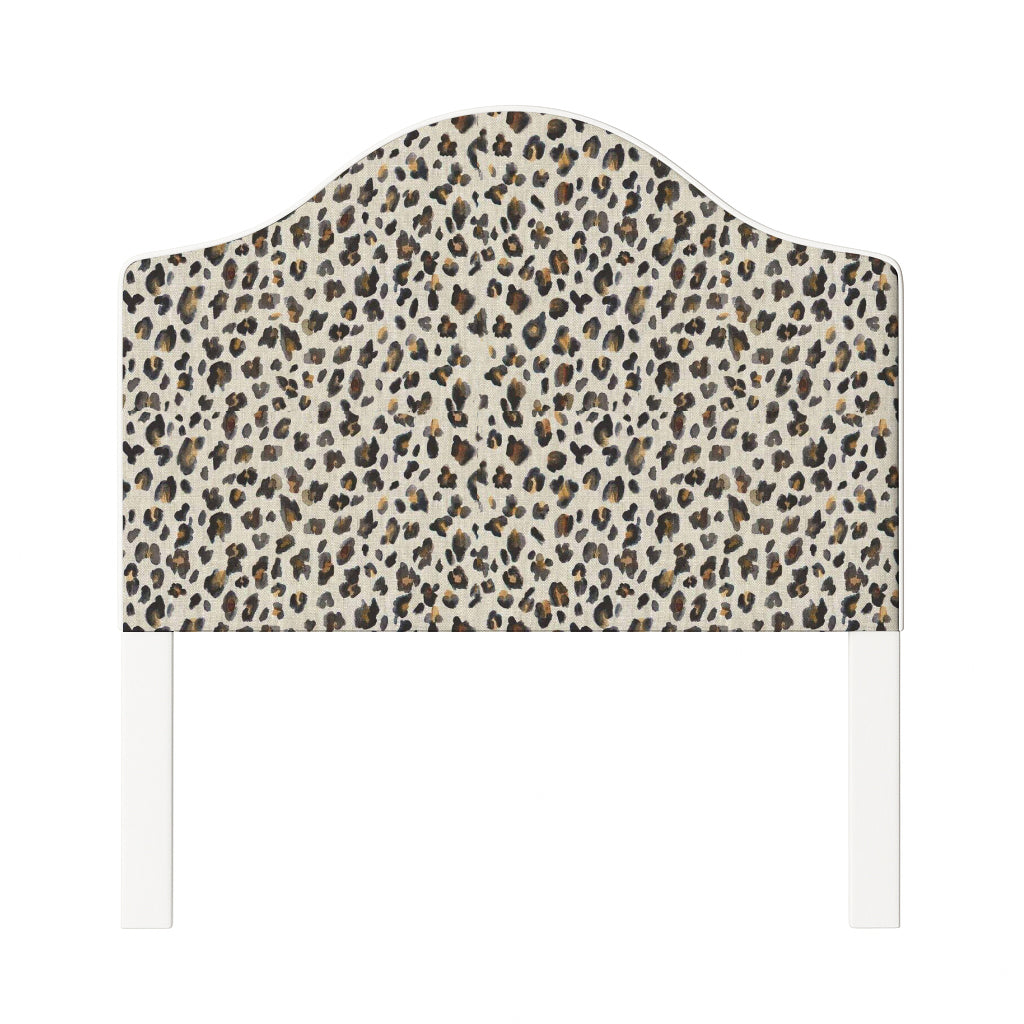 Daisy upholstered headboard in Fabric&Frame Spinach on Pink, shown on a white bed base in a modern bedroom.