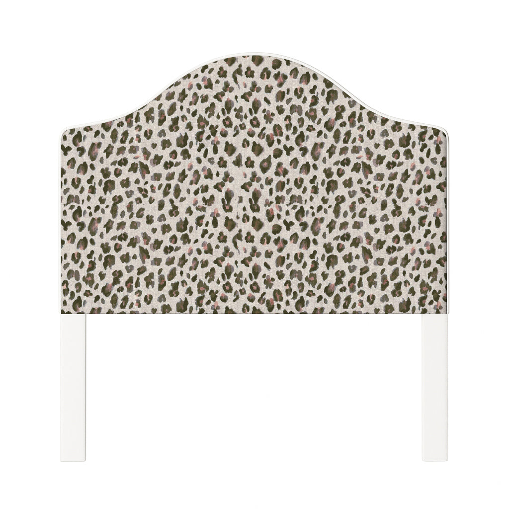 Daisy upholstered headboard in Fabric&Frame Spinach on Pink, shown on a white bed base in a modern bedroom.