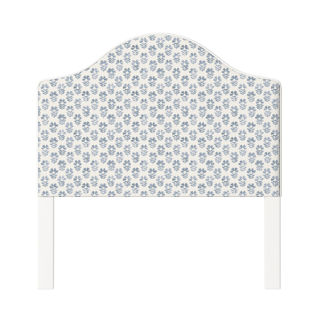 Daisy upholstered headboard in Fabric&Frame Natural, shown on a white bed base in a modern bedroom.