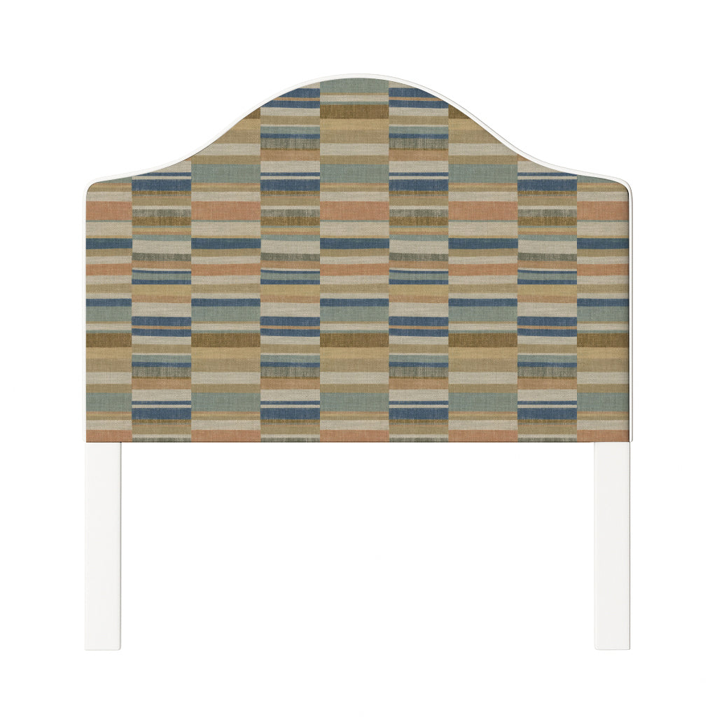 Daisy upholstered headboard in Fabric&Frame Rhubarb, shown on a white bed base in a modern bedroom.