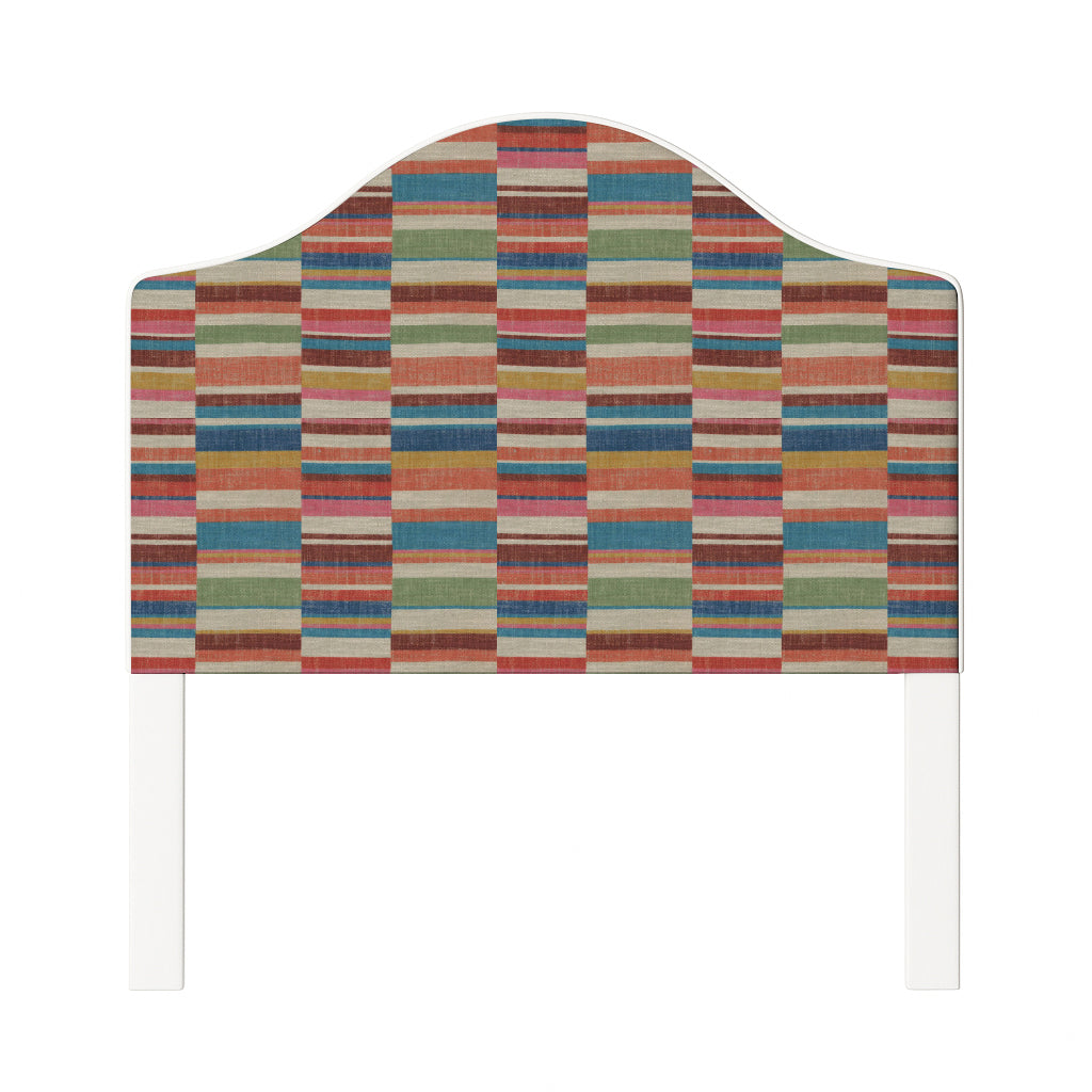 Daisy upholstered headboard in Fabric&Frame Rhubarb, shown on a white bed base in a modern bedroom.