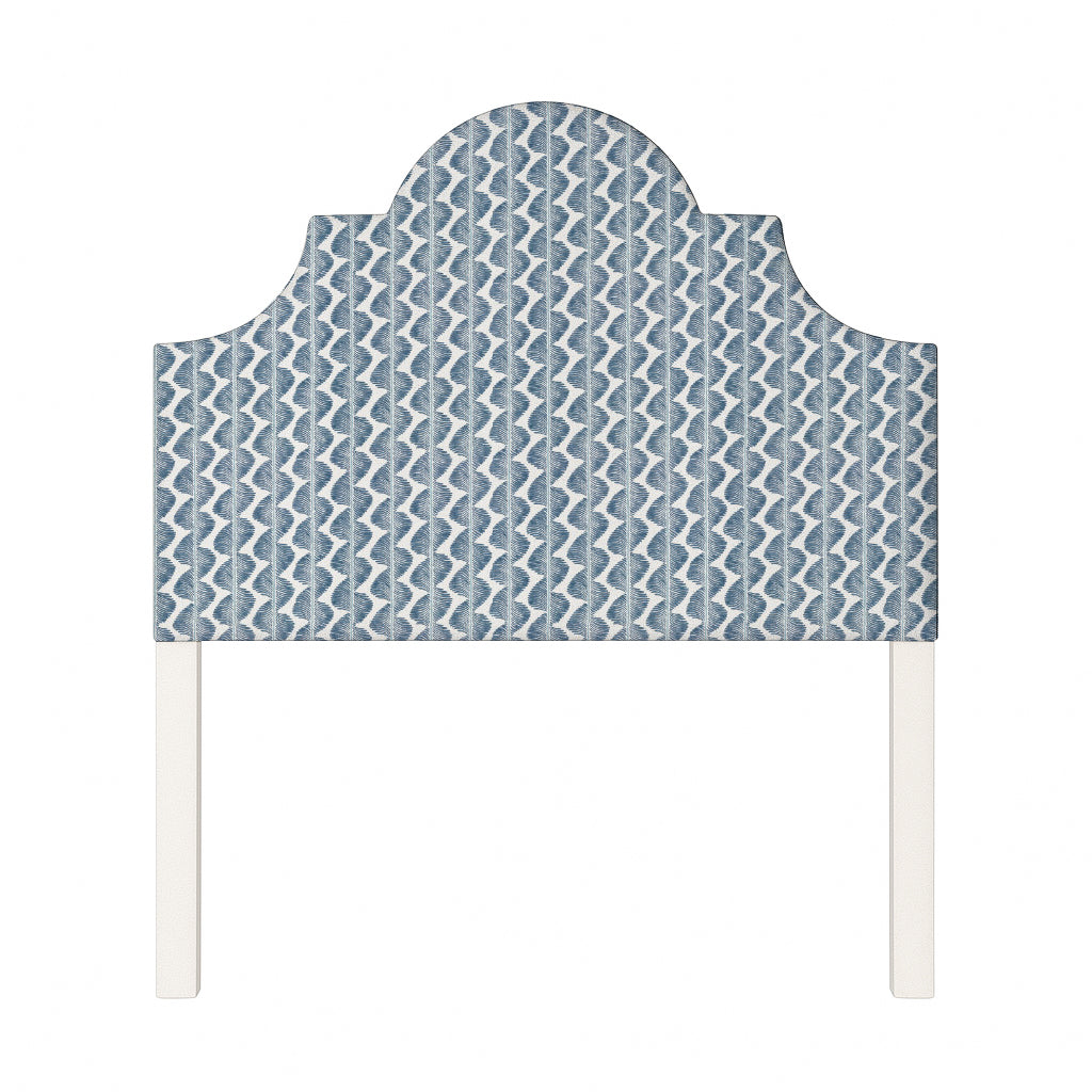 Florence upholstered headboard in Fabric&Frame Buxton Blue, shown on a white bed base in a modern bedroom.