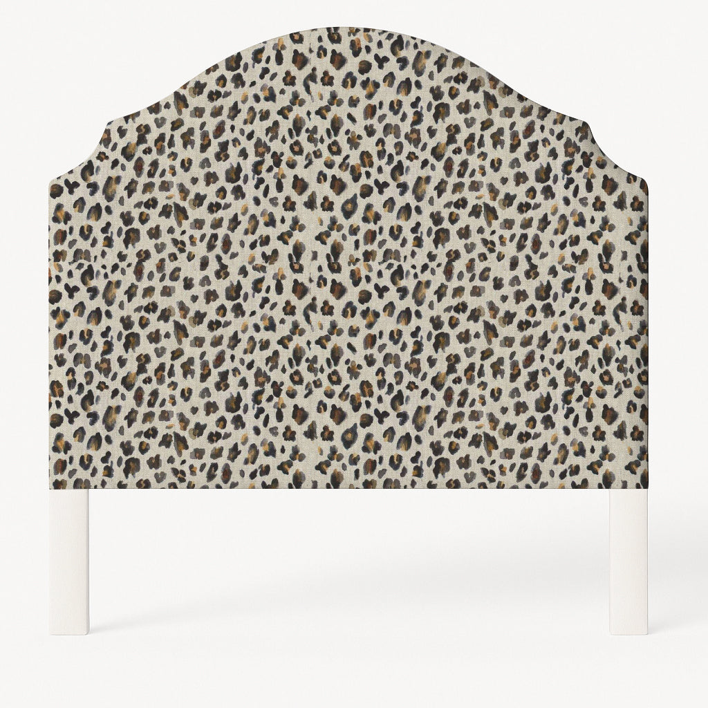 Grace upholstered headboard in Fabric&Frame Spinach on Pink, shown on a white bed base in a modern bedroom.