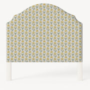Grace upholstered headboard in Fabric&Frame Ochre, shown on a white bed base in a modern bedroom.