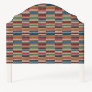 Grace upholstered headboard in Fabric&Frame Rhubarb, shown on a white bed base in a modern bedroom.