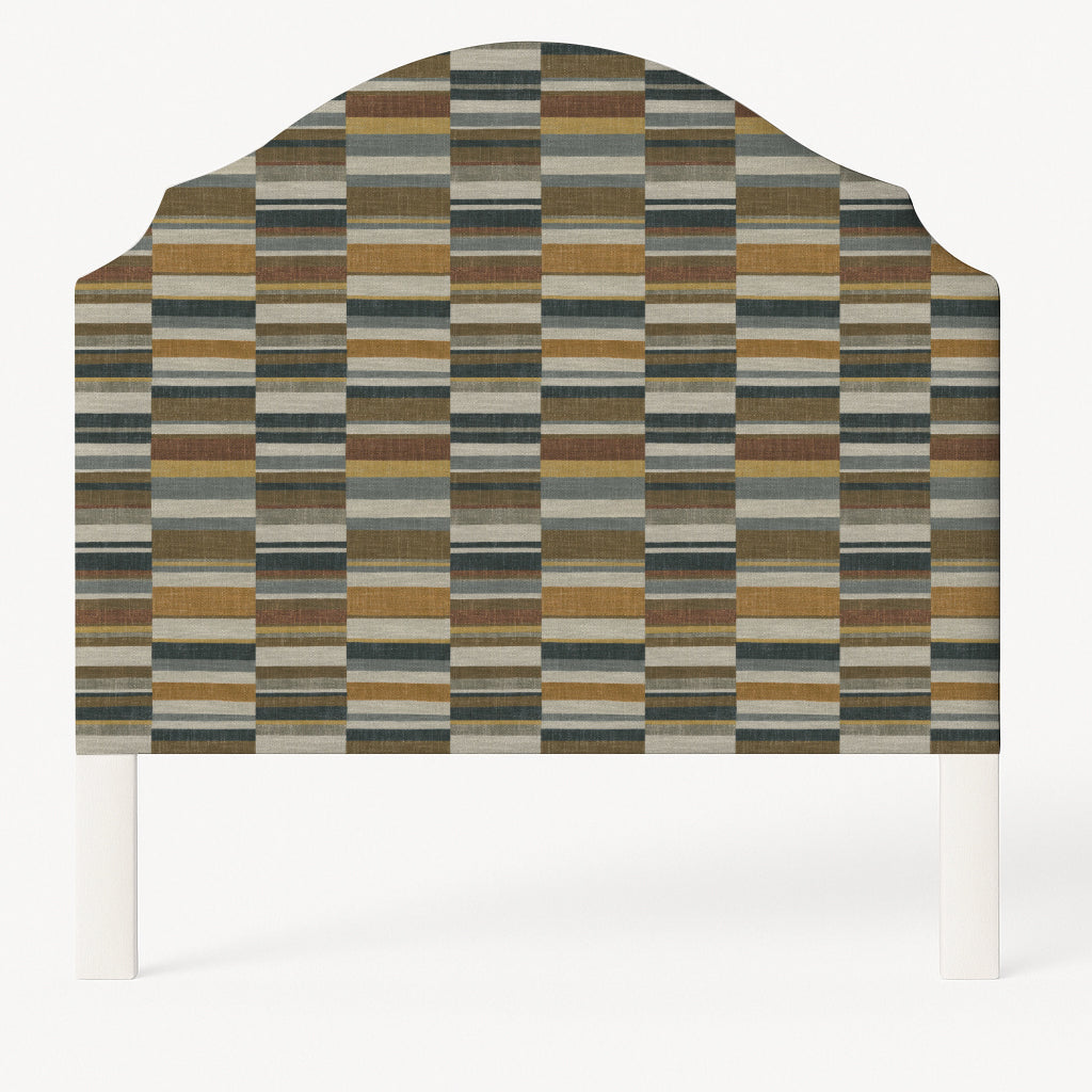 Grace upholstered headboard in Fabric&Frame Rhubarb, shown on a white bed base in a modern bedroom.