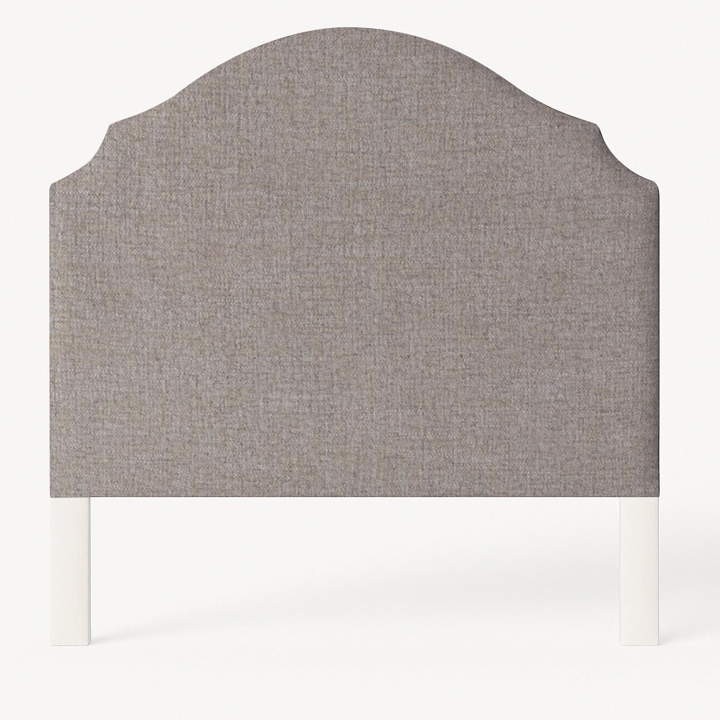 Grace upholstered headboard in Fabric&Frame Santorini, shown on a white bed base in a modern bedroom.