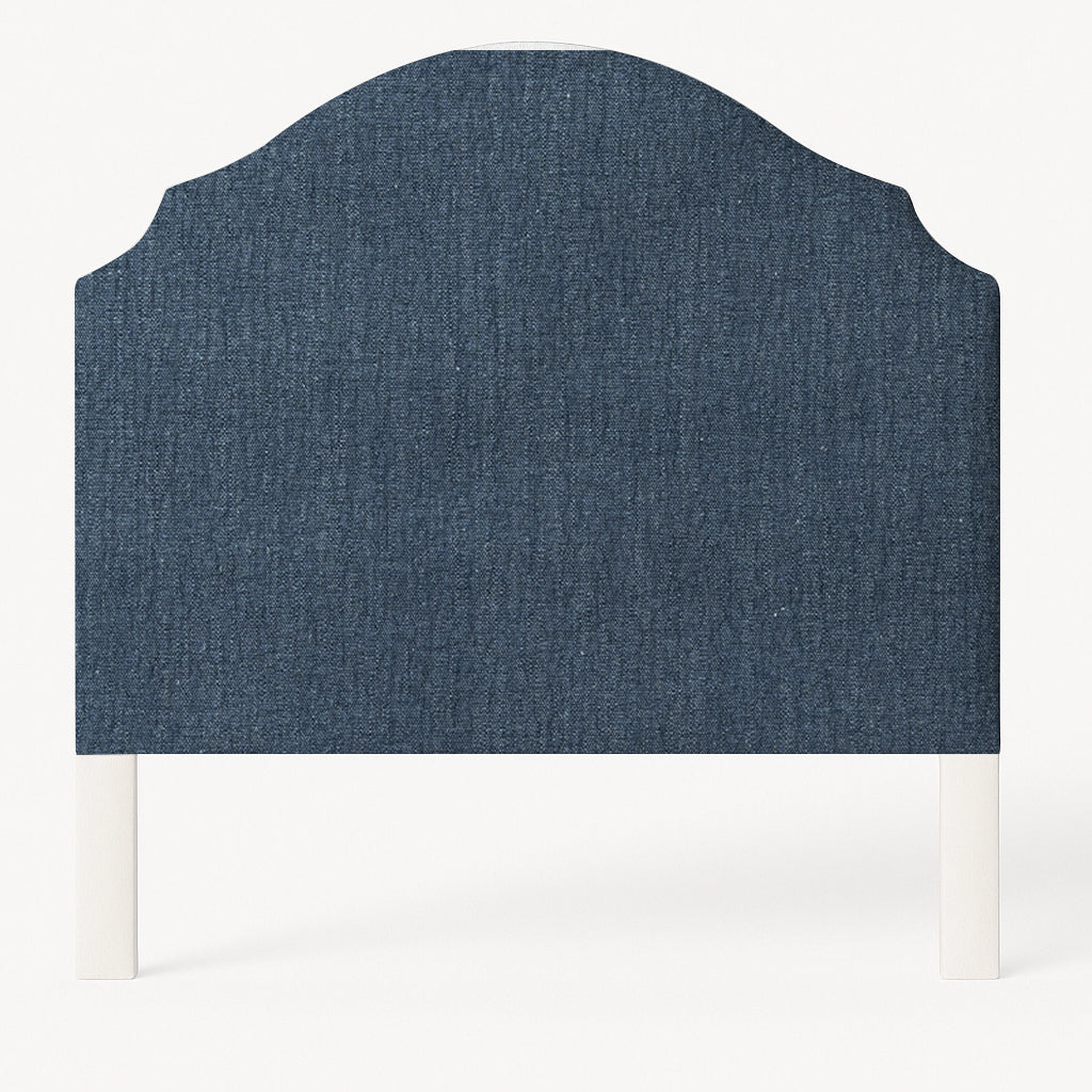 Grace upholstered headboard in Fabric&Frame Santorini, shown on a white bed base in a modern bedroom.