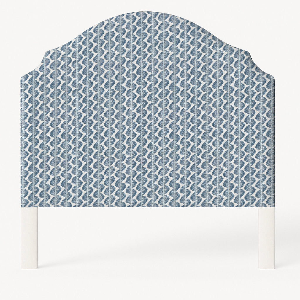 Grace upholstered headboard in Fabric&Frame Buxton Blue, shown on a white bed base in a modern bedroom.