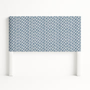 Iris upholstered headboard in Fabric&Frame Buxton Blue, shown on a white bed base in a modern bedroom.