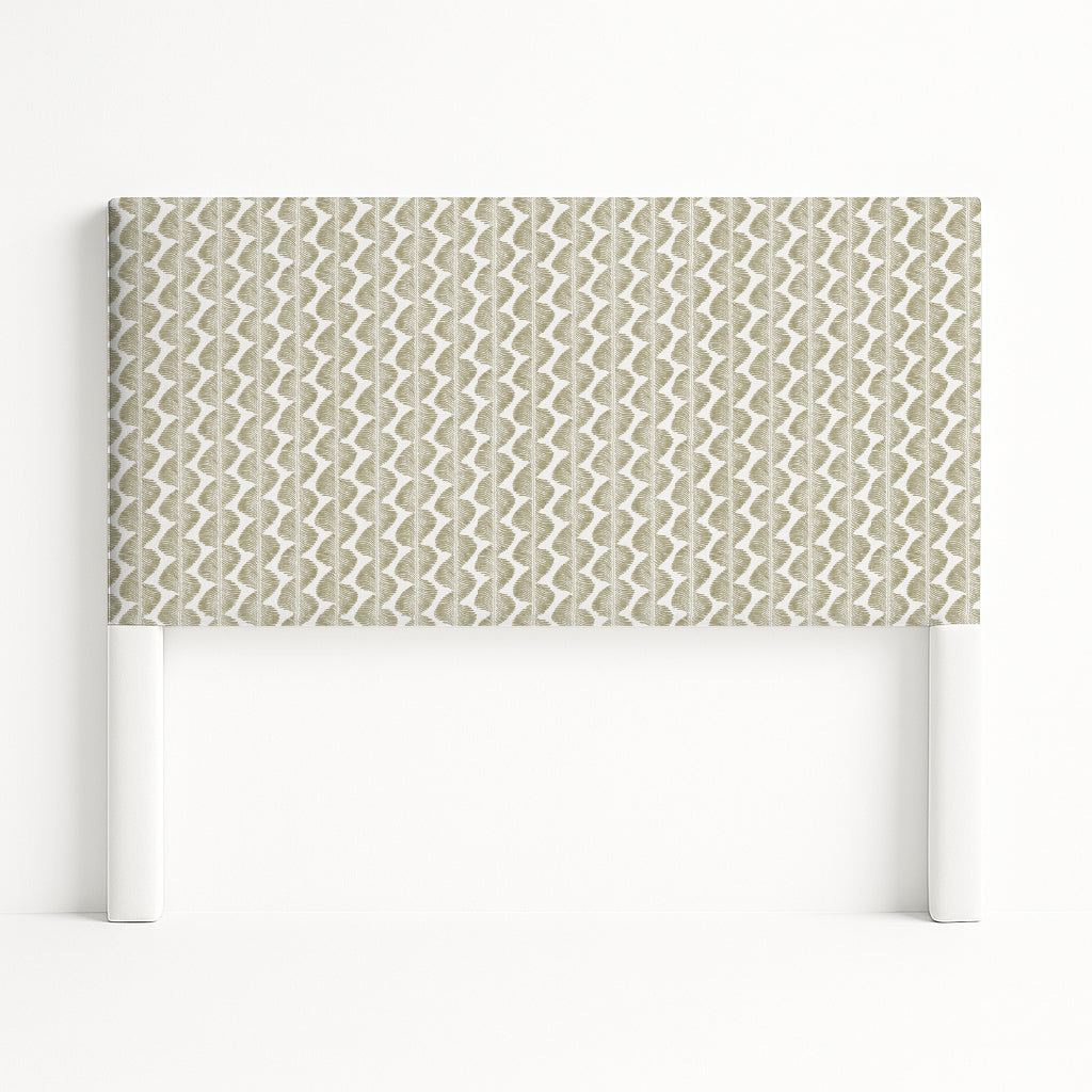 Iris upholstered headboard in Fabric&Frame Buxton Blue, shown on a white bed base in a modern bedroom.