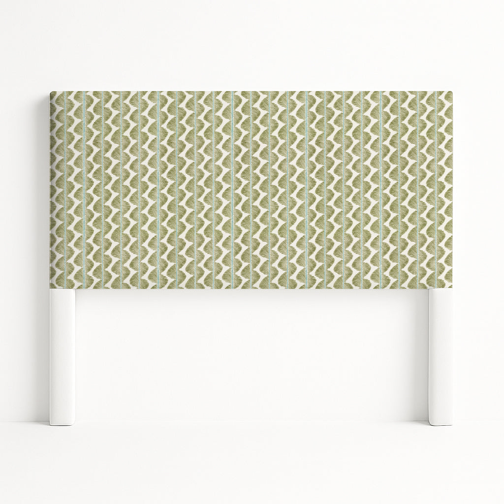 Iris upholstered headboard in Fabric&Frame Buxton Blue, shown on a white bed base in a modern bedroom.