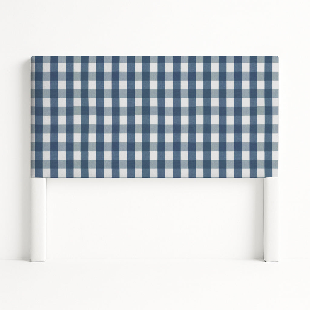Iris upholstered headboard in Fabric&Frame Indigo, shown on a white bed base in a modern bedroom.