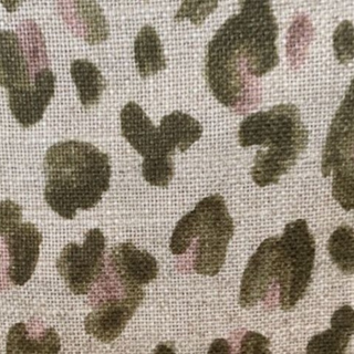 Grace upholstered headboard in Fabric&Frame Spinach on Pink, shown on a white bed base in a modern bedroom.